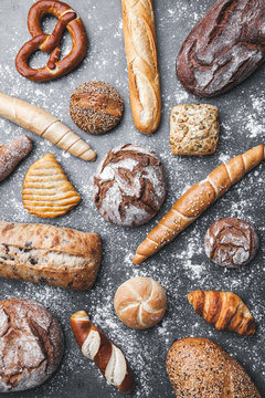 Delicious fresh bread on rustic background