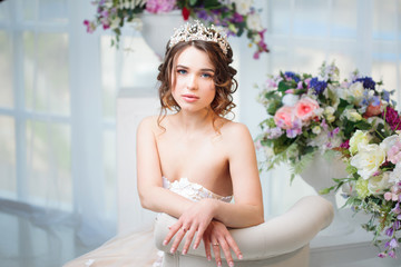 Portrait, wedding hair style, brunette with curly hair. Beautiful girl in a wedding dress. Close-up © Ulia Koltyrina