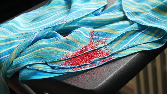 Blue Scarf And Red Sequins. Blue Curtain In The Wind, Scattered Spangles.