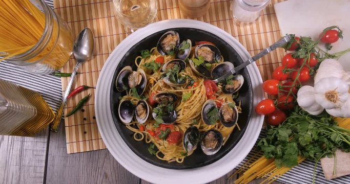 Top down zoom in view of delicious Italian spaghetti alle vongole (clams)