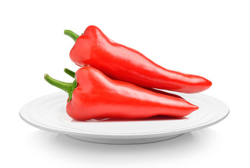 red sweet pepper in plate on white background