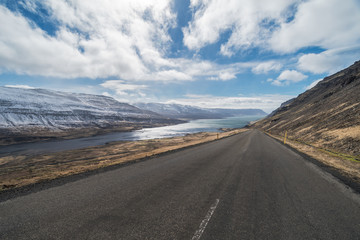Looking down the road at dramatic scenery, isolation, Kollafjordur, Westfjords, Iceland