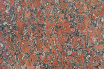Pattern of red granite, closeup. Background, textured.