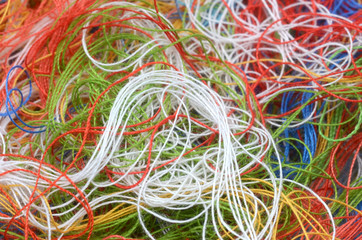 yarn in many colors on a jean template