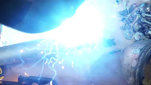 build a custom motorcycle. a mechanic works on the table. slow motion