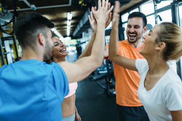 Picture of cheerful fitness team in gym