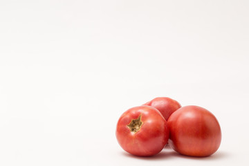 fresh tomatos isolated on white background