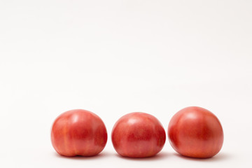 fresh tomatos isolated on white background
