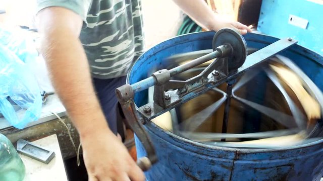 Machine for honey extraction during work. Honey extractor machine