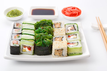 Set of sushi and rolls on white background closeup