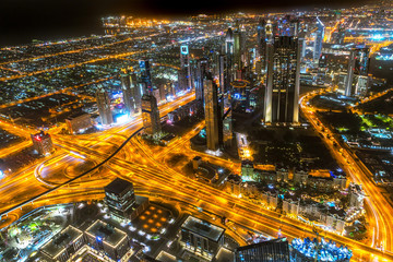 Fototapeta na wymiar Skyscrapers of Dubai at night, UAE