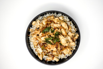 Rice and chicken on white plate