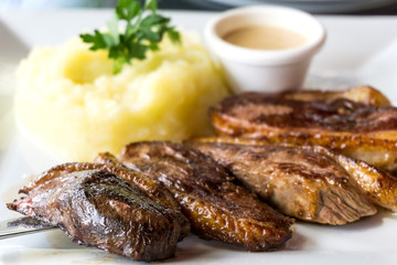 juicy steak beef meat with tomato and potatoes