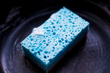 Blue Dishwashing Sponge with Black Background