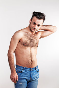 Boy with naked hairy chest on white background