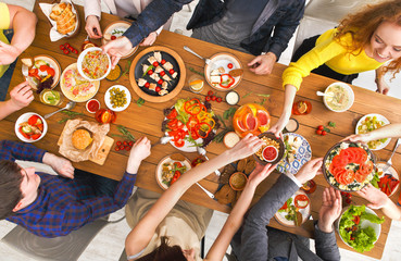 People eat healthy meals at served table dinner party