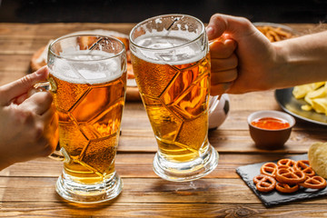 Appetizers and beer on the table for watch the football match.