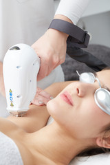 Beautician Removing Hair Of Young Woman's Armpit.