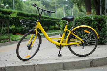 Fototapeta na wymiar Yellow City Bicycle with Green Background