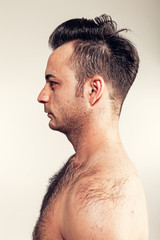Obraz premium Boy with naked hairy chest on white background