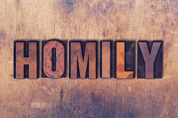 Homily Theme Letterpress Word on Wood Background