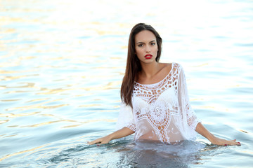 Young woman beauty portrait in water