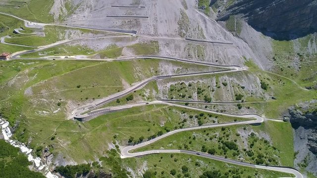Aerial 4K - Stelvio National Park - Valle del Braulio - Vista della strada e tornanti salendo da Bormio