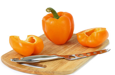 Pepper, knife on the board isolated on white background