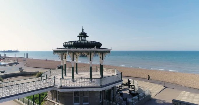 Aerial pull out view of the Victorian bandstand and the ruin of the West pier in Brighton and Hove