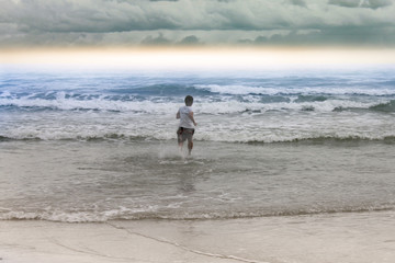 Fototapeta na wymiar Shadow man running to the beach 