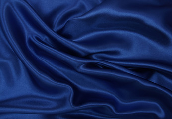 Smooth elegant blue silk or satin luxury cloth texture as abstract background. Luxurious background...