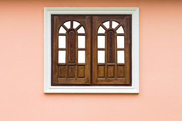 Wooden windows in concrete frames.