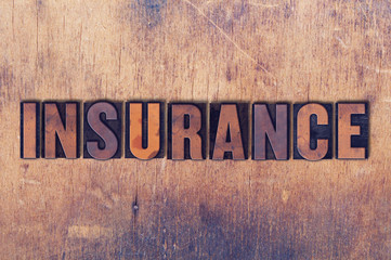 Insurance Theme Letterpress Word on Wood Background