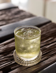 Iced Green tea with on wood table in cafe