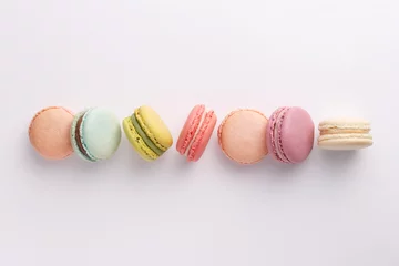 Acrylic prints Macarons Macarons on white background. Colorful french desserts. Top view