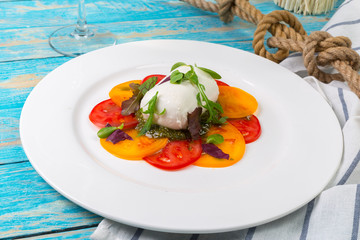 Colourful slices of cheese and tomato