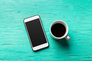 phone and coffee on wood blank space