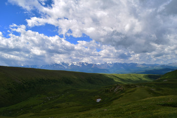 Fototapeta na wymiar Green hills of Altai mountains and North-Chuyski ridge. Altay Region, Siberia, Russia.