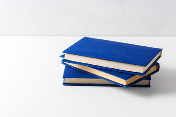  pile of paperback books on a table