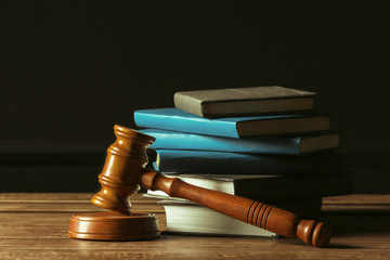 Gavel With Books On Old Wooden Desk