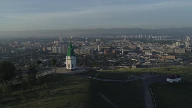 Church of Paraskeva Pyatnitsa is symbol of Krasnoyarsk. City in Siberia, Russia. Russian old architecture. Aerial drone flight around. 4K format