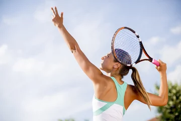 Poster Young woman playing tennis © BGStock72