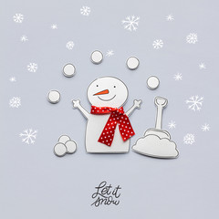 Merry christmas / Creative photo of a snowman made of paper on grey background.