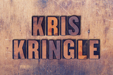 Kris Kringle Theme Letterpress Word on Wood Background