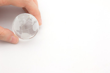 Closeup of a glass globe holding in hands