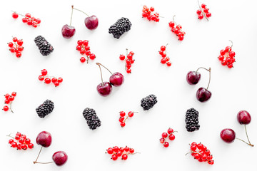 Berry pattern. Red currant, blackberry and cherry on white background top view
