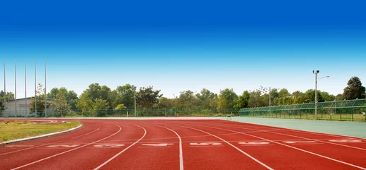 Foto op Plexiglas Running track with lanes over sky and clouds © seekeaw