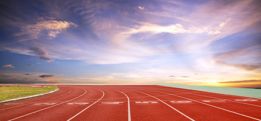 Running track with lanes over sky and clouds