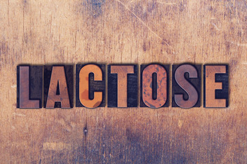 Lactose Theme Letterpress Word on Wood Background