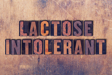 Lactose Intolerant Theme Letterpress Word on Wood Background